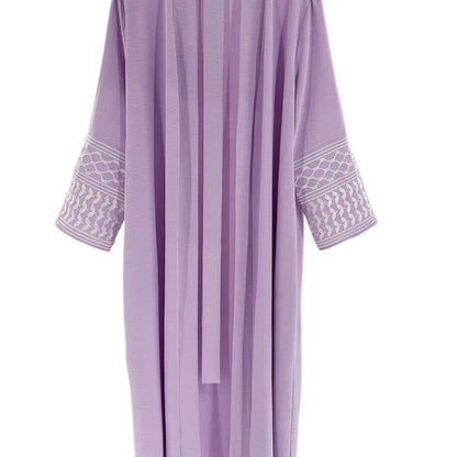 Kuffiyeh-inspired abaya with embroidered sleeves and detachable belt.